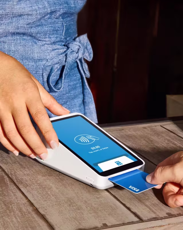 Tap-to-pay handheld terminal — customer with credit card